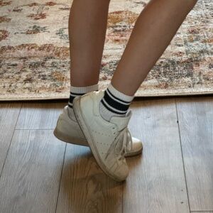 Worn white adidas Stan smith sneakers